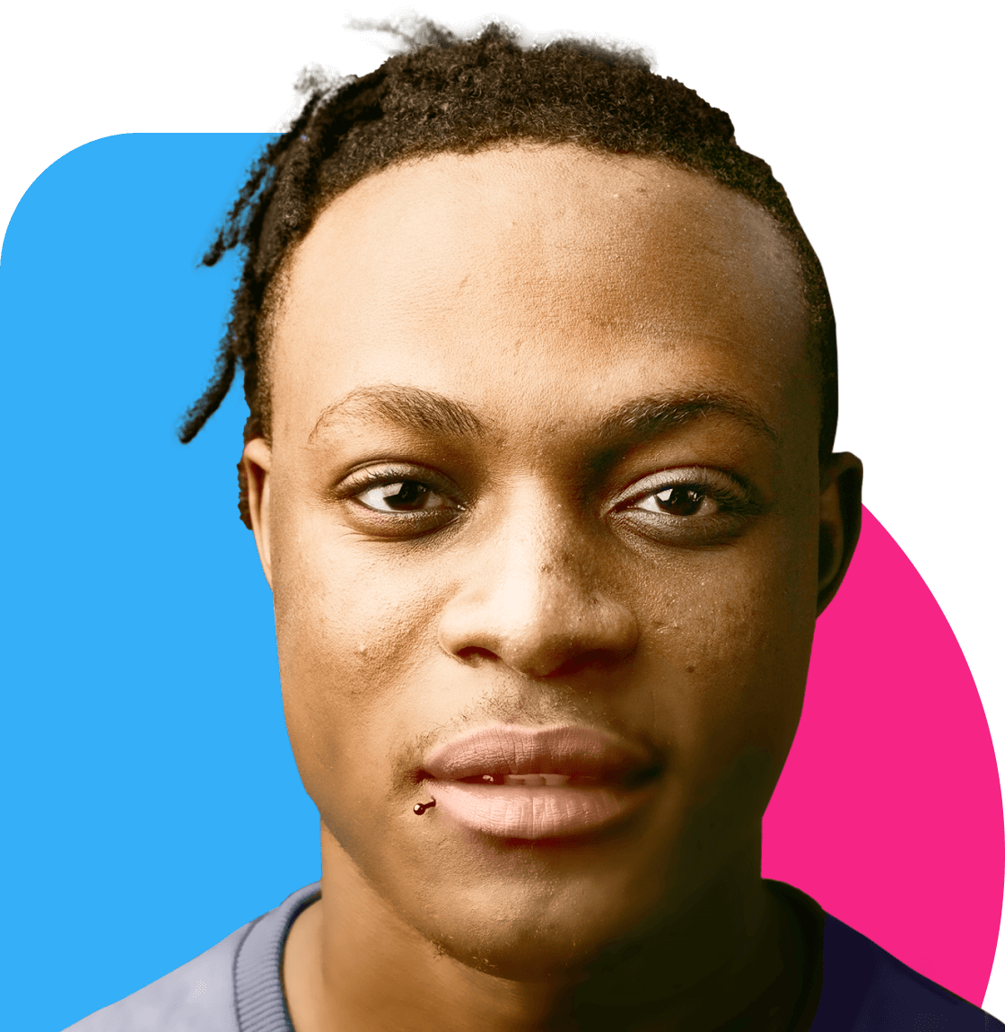 A young black man with dreadlocks in a navy shirt looking at the camera