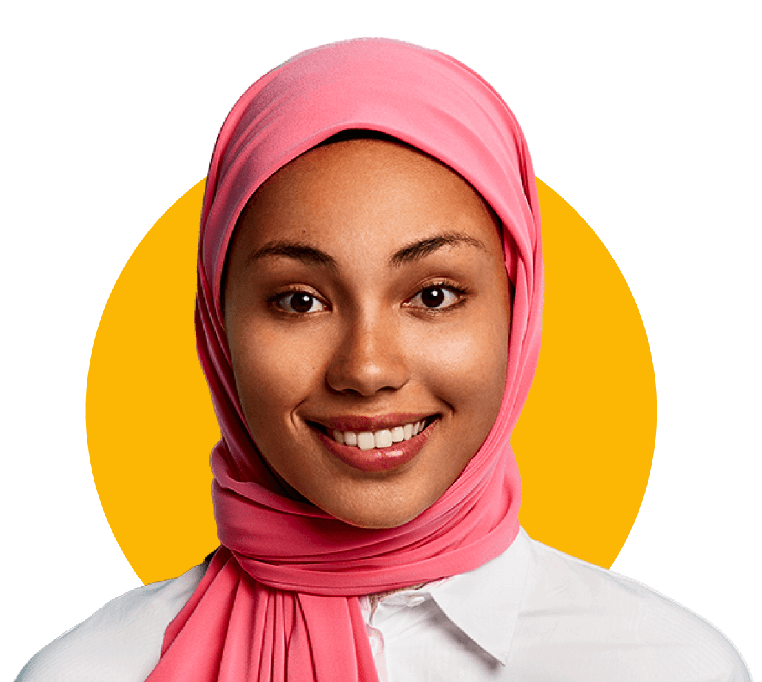 Young woman in front of a yellow circle with a covered head smiling at the camera